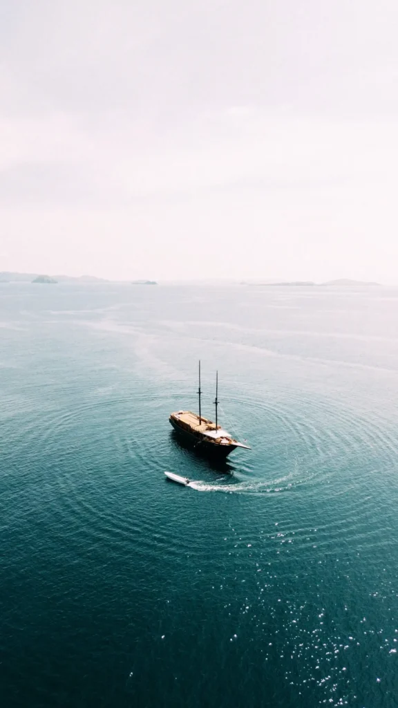 Exterior of the 38m Angelica phinisi liveaboard on the water off Labuan Bajo
