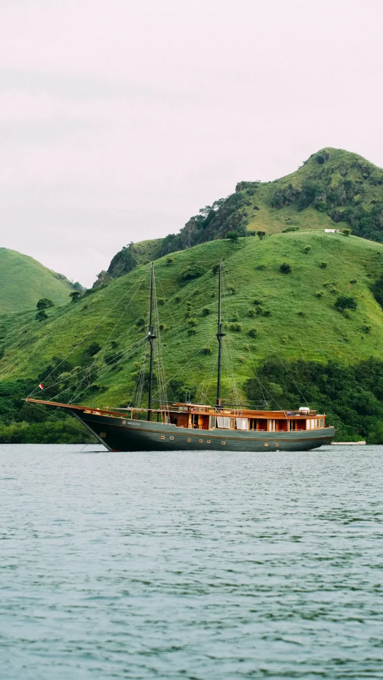 Angelica phinisi liveaboard under sail in Komodo National Park near Labuan Bajo