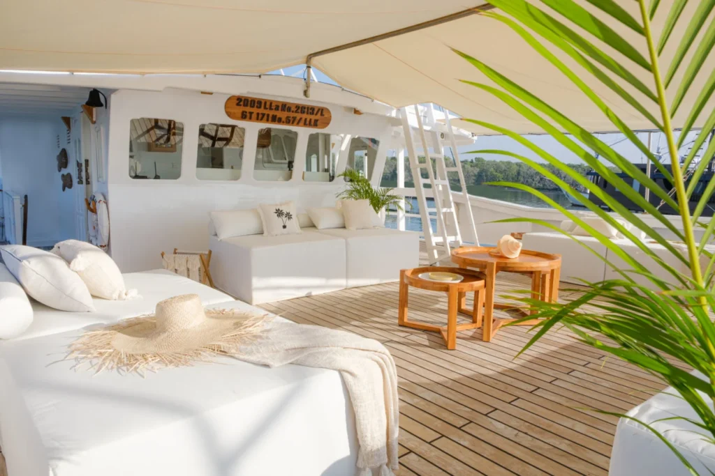 Upper deck lounge used for yoga and open-air cinema on Aliikai Voyage
