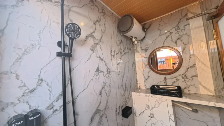 Private bathroom in a Premiere Panoramic cabin aboard Arfisyana 2