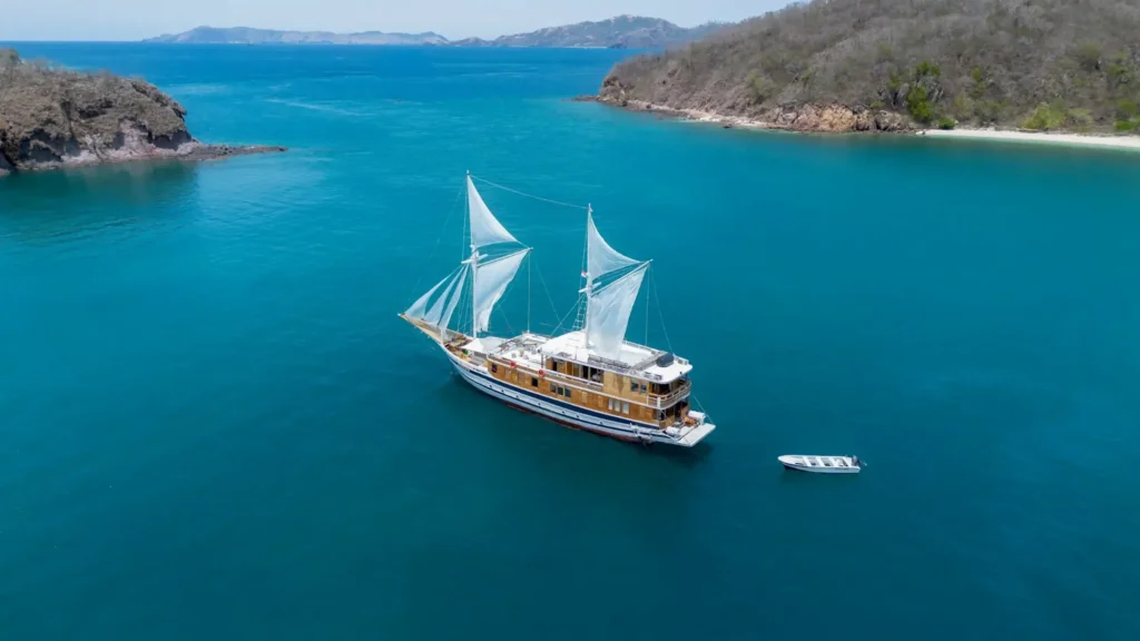 Catnazse phinisi under way through Komodo National Park