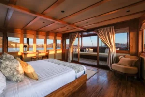 Celestia Master Stateroom with king bed and doors opening to its private terrace