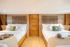 Cabin 9 family suite in the bow of Chakana with two double beds
