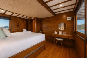 Junior Suite Stateroom with queen bed on the main deck of KAI Voyage