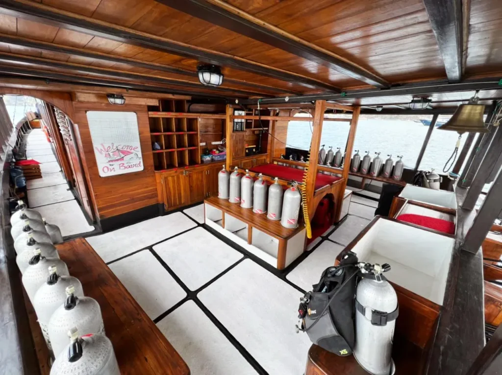 Tanks and equipment laid out on the La Galigo dive deck