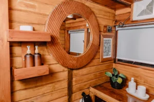 Mirror and storage detail in a La Galigo Master cabin