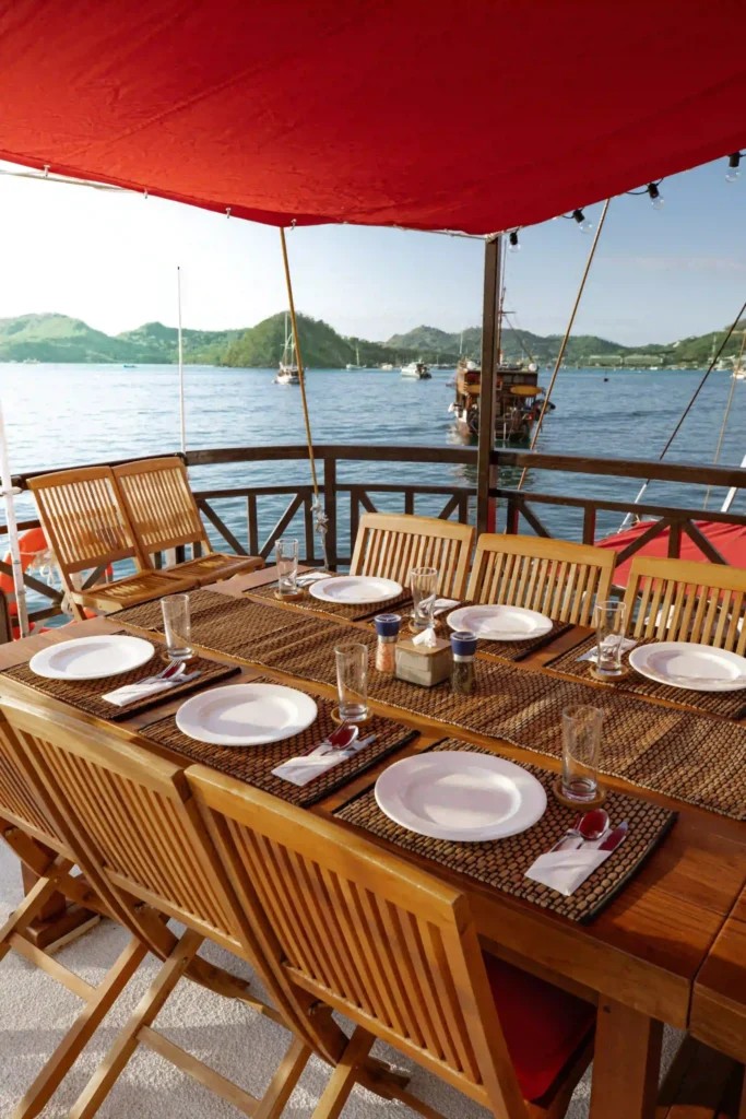 Shaded dining table on the La Galigo sun deck