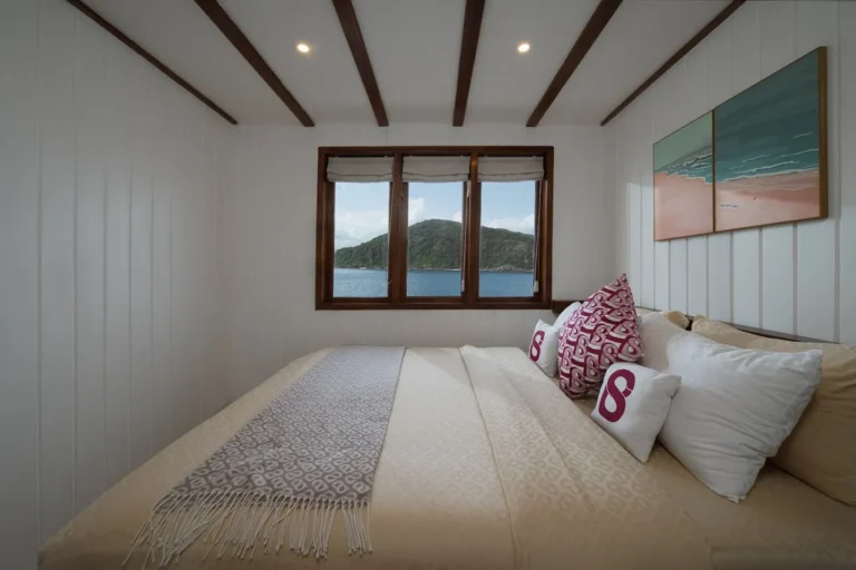 Queen bed in the Marbella cabin aboard Le Costa