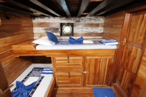 Twin cabin aboard Moana Cruising with two single beds