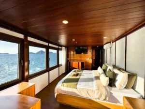 Mansard II cabin aboard Neptune Cruise with queen bed