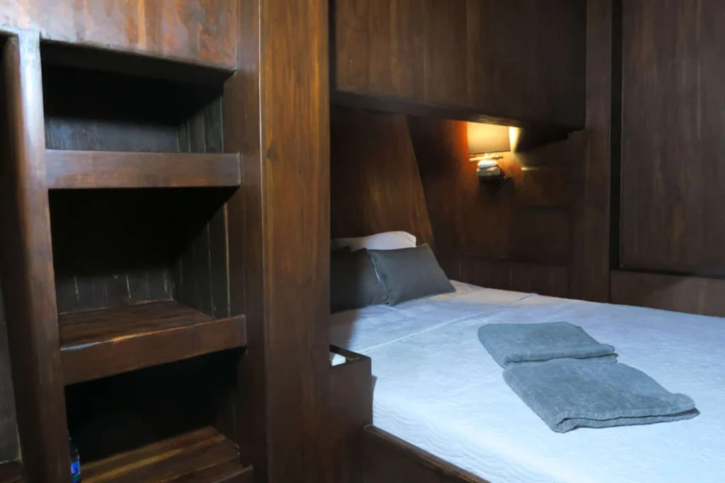Lower deck double cabin with storage shelving aboard Nyaman
