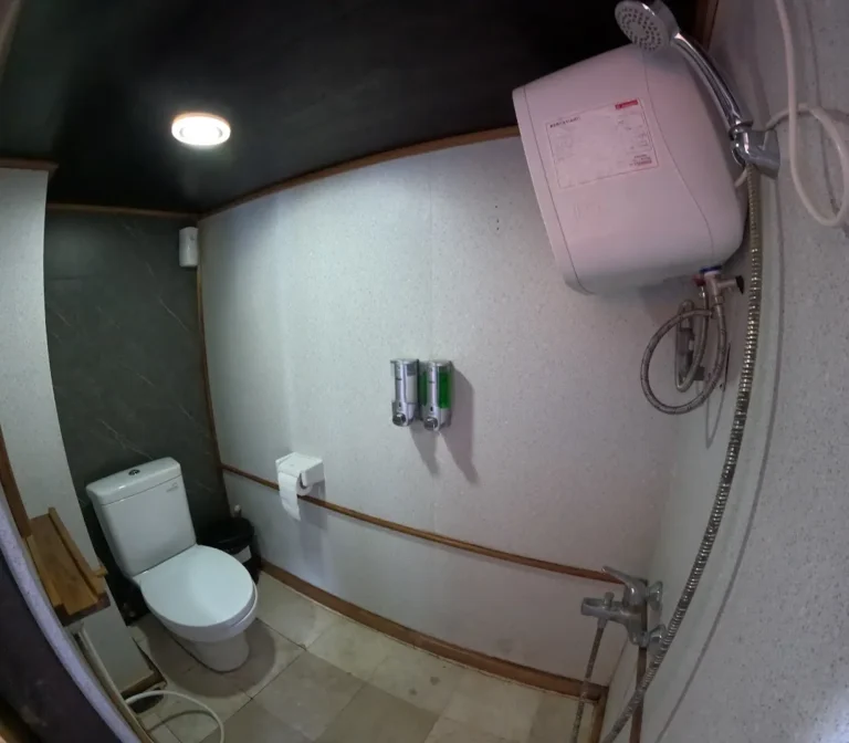 Upper-deck Deluxe Cabin ensuite bathroom aboard Revfiero phinisi