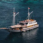 Semesta Voyages, a 32-metre phinisi built in 2023, sailing in Komodo National Park