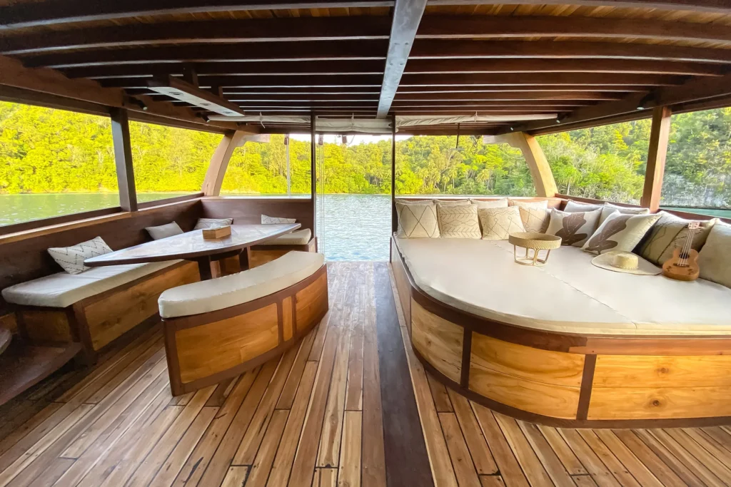 Private terrace with sunbed and bathing platform aboard Senja
