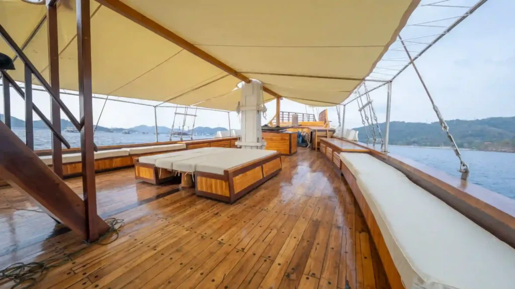 Outdoor lounge with sofas on Seven Angel, open to the sea on three sides