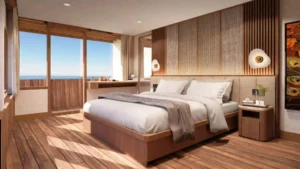 Merak Suite on Sukha Sail 2 seen from the balcony doors toward the bed