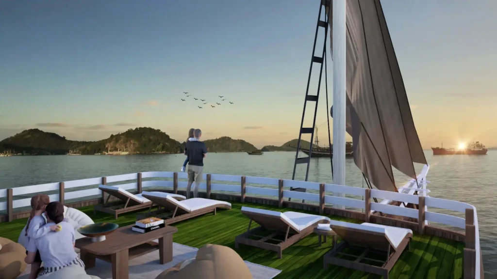 Sun deck of Sukha Sail 2 with loungers and open sea views over Komodo