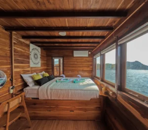 Sundari deluxe balcony cabin interior aboard Sundari Voyages phinisi