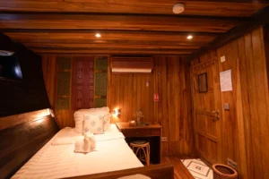 Twin suite aboard Tambora, with two large single beds and no bunks