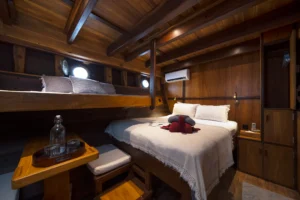 Ta’Talasa Asmat Cabin with queen bed and retractable single berth