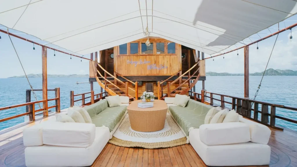 Outdoor guest deck and seating area aboard Zada Nara
