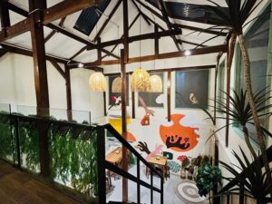 Two-level interior and seating at Mimamori Cafe in Labuan Bajo