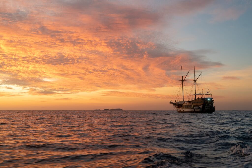 Wellenreng phinisi at sunset in Indonesia