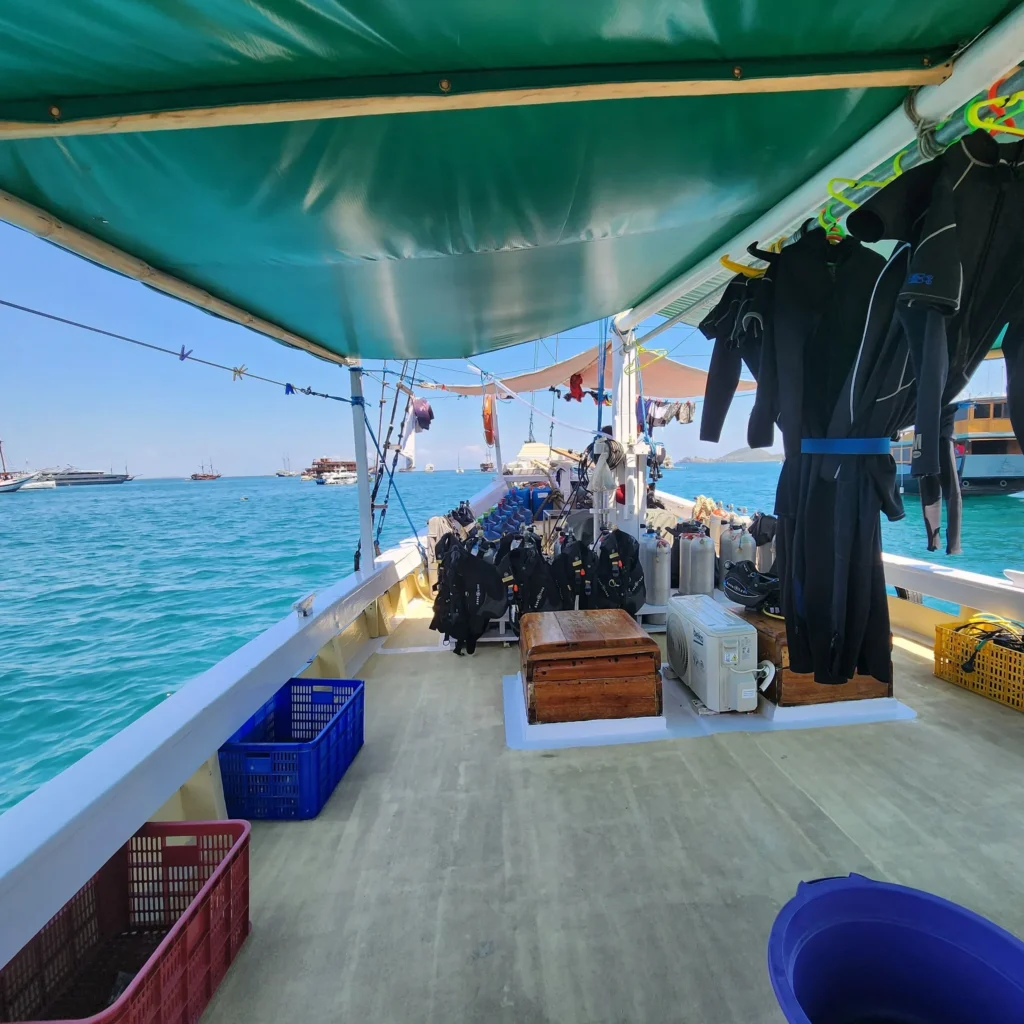Shaded dive deck and scuba equipment aboard Bajak