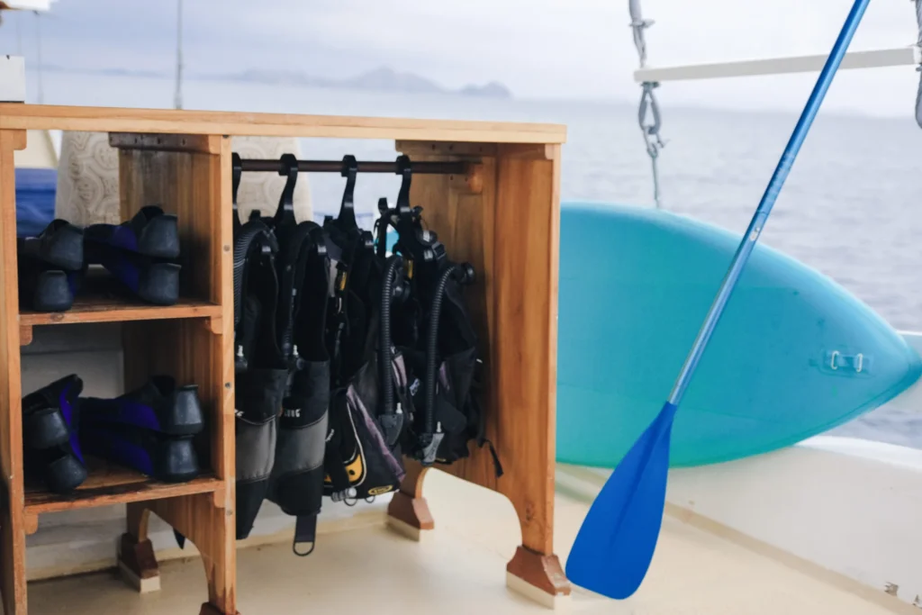 Dive equipment and paddleboard aboard Jinggo Janggo