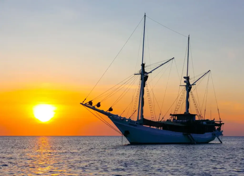 Katharina anchored against a sunset in eastern Indonesia