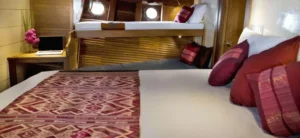 Wooden cabin interior aboard Mantra Phinisi